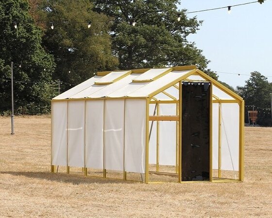 greenhouse converts into inhabitable light installation for music festival in the UK