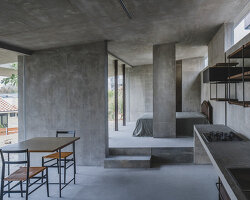 overlapping concrete walls and columns blur inside and outside in okinawa house