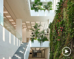 KIAS pairs textured brick facade with planted atrium for headquarters in japan