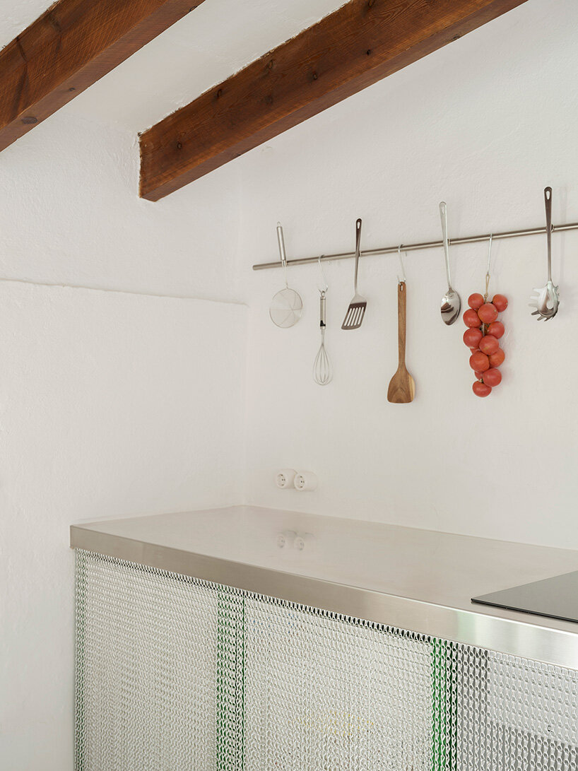 KOSMOS transforms mallorcan townhouse by giving old materials new roles - 5