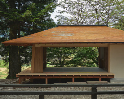 leaning timber frame anchors shrine office in japanese mountain valley