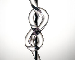 figure-eight knot casts into a glass light sculpture projecting shifting shadows