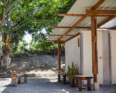 volunteers in thailand hand-build school toilet from reclaimed wood