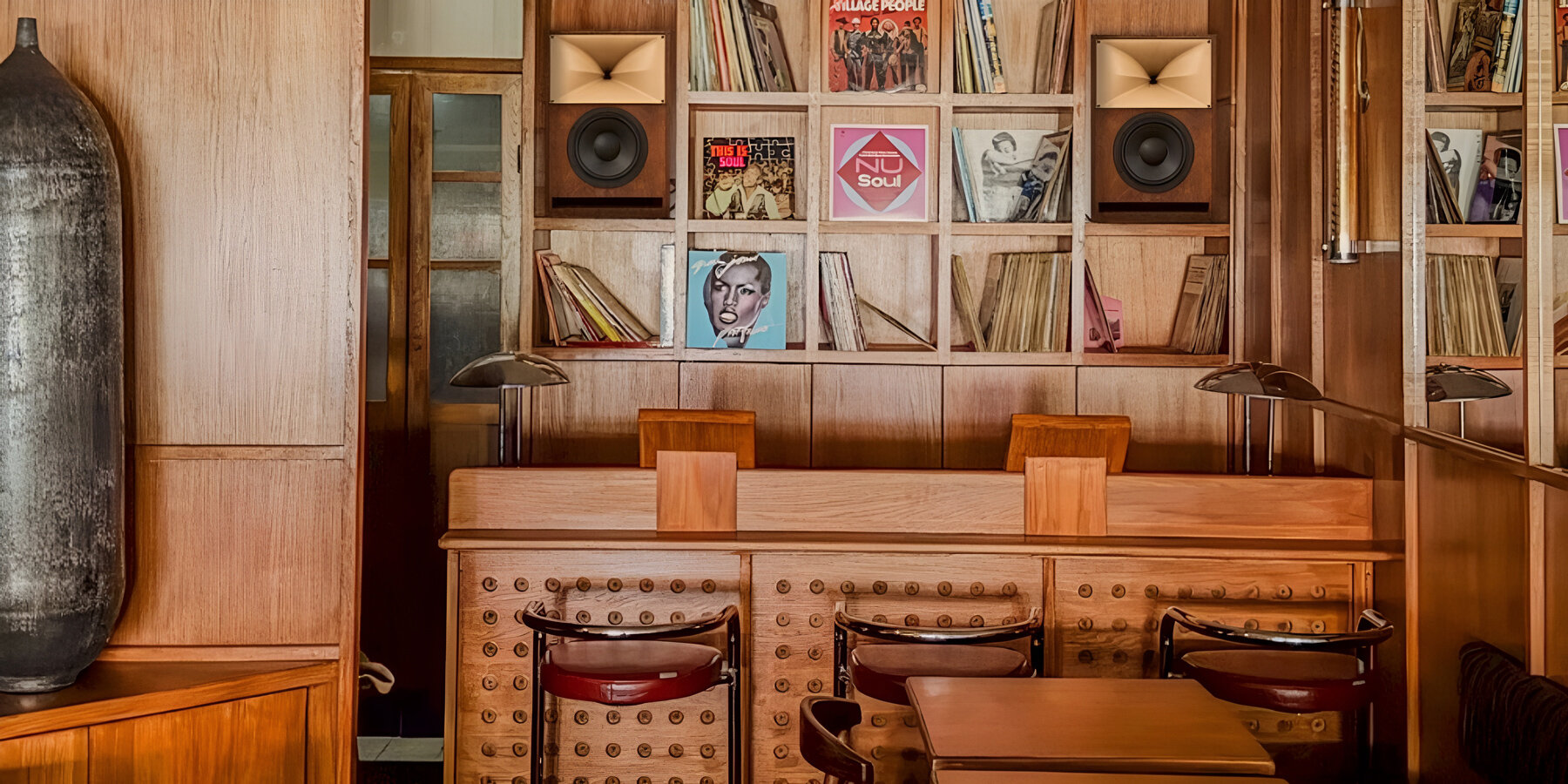SOBO wraps paris listening restaurant in oak, vintage furniture, and acoustic panels