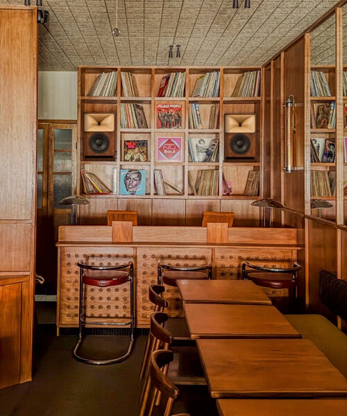 SOBO wraps paris listening restaurant in oak, vintage furniture, and acoustic panels