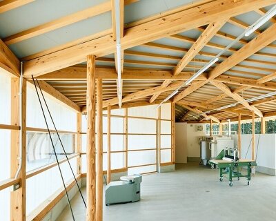 triangular timber structure encloses tsukumo kiln ceramic studio in kobe, japan