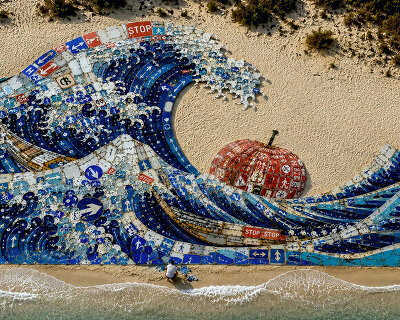 discarded road signs transform into monumental land art installation on sardinian shore