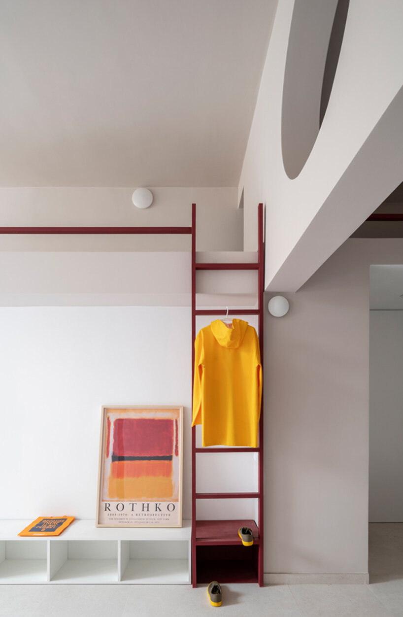 garnet-red accents and high clerestories punctuate AA Apartments in málaga - 5