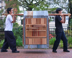 built from upcycled timber and iron, portable micro-barn wanders through japan