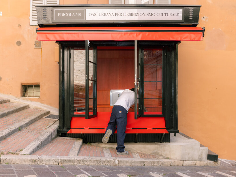 historic perugia newsstand reconfigures into stepped red oak mini reading kiosk - 2