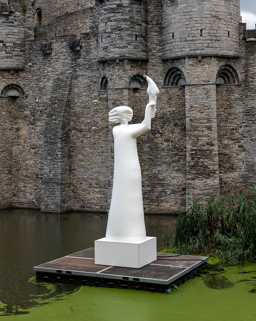 the figure’s simplified features and inflated surface are visible up close