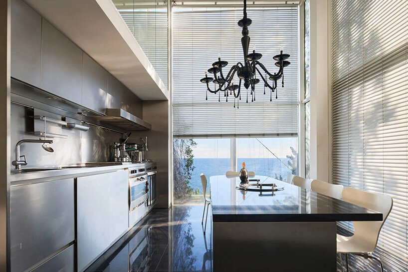 stainless steel kitchen and dining area with views of the Mediterranean