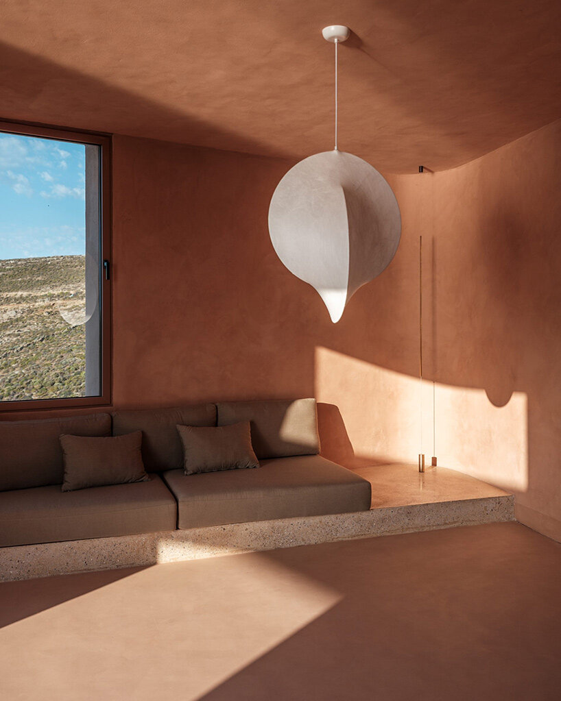 MOLD punctures terracotta-colored greek island 'M residence' with seven open-air courtyards - 1