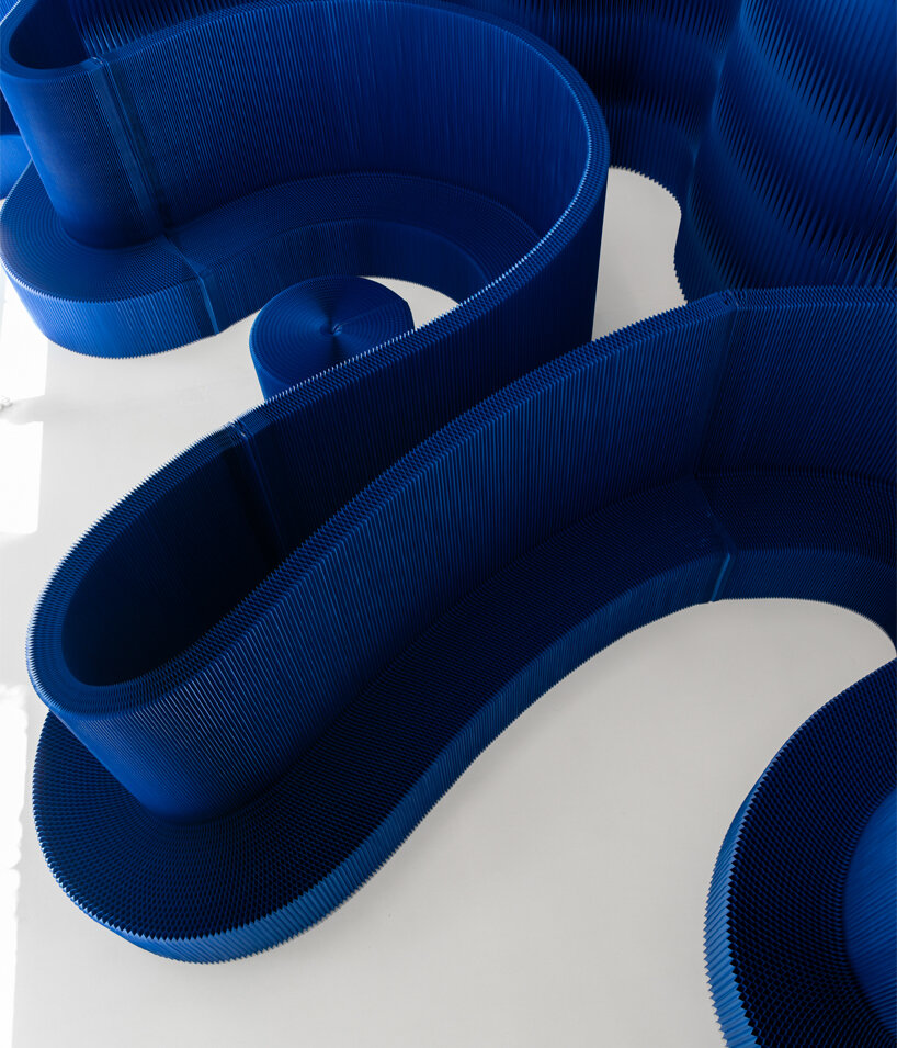 softwall by molo translates nature-inspired blues into a flexible, light-responsive paper partition system - 1