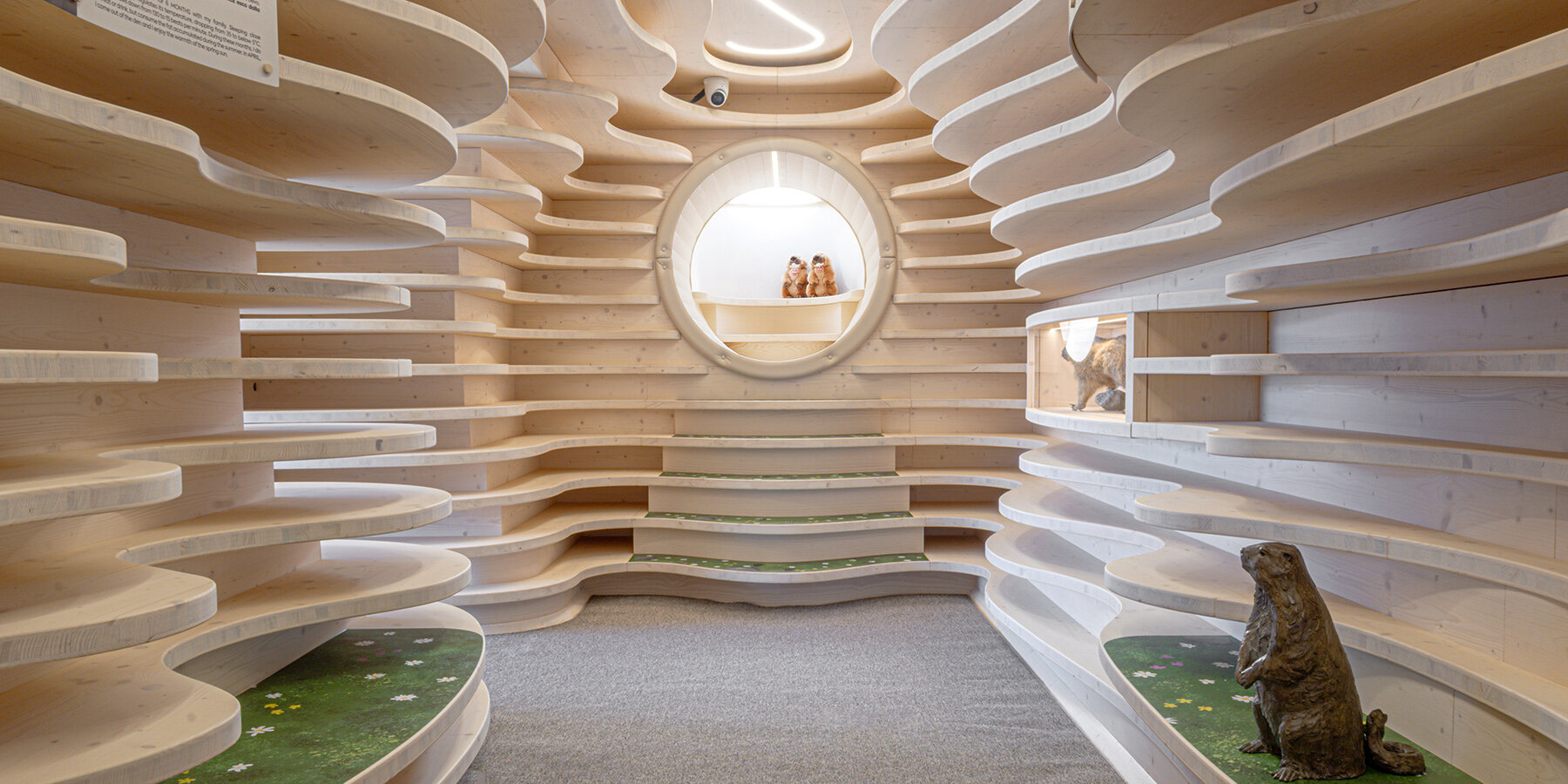 officina-82-tana-delle-marmotte-corten-steel-tubes-plywood-ribs-subterranean-learning-space-designboom-1800-2