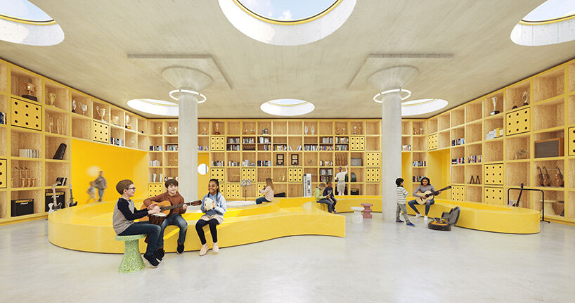Students play instruments and read in a library with floor-to-ceiling yellow shelving, curved benches, and circular skylights