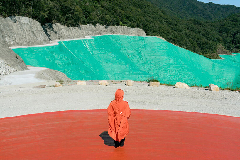 ryue nishizawa places vivid orange peak against turquoise landfill in japan - 4