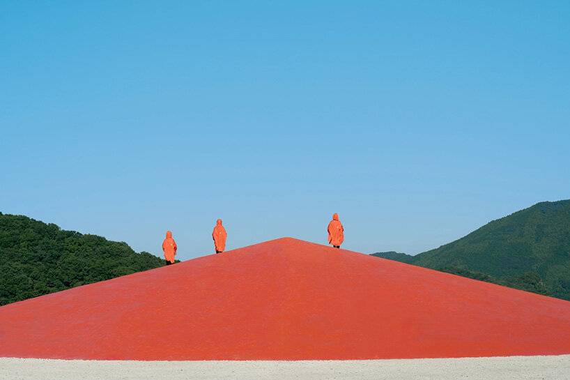 ryue nishizawa places vivid orange peak against turquoise landfill in japan - 1