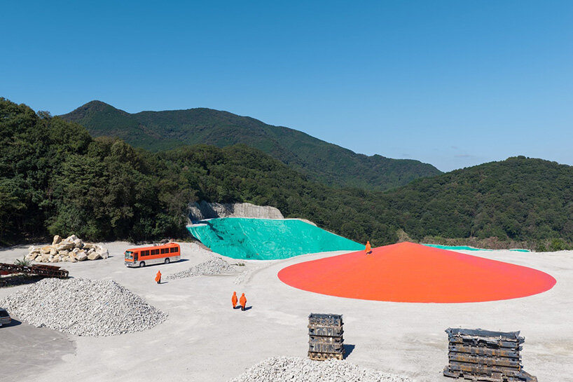 ryue nishizawa places vivid orange peak against turquoise landfill in japan - 2
