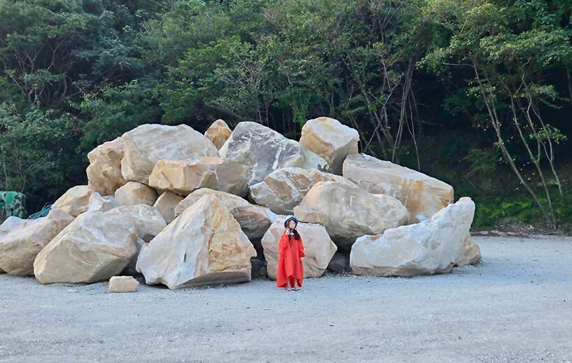 ryue nishizawa places vivid orange peak against turquoise landfill in japan - 5