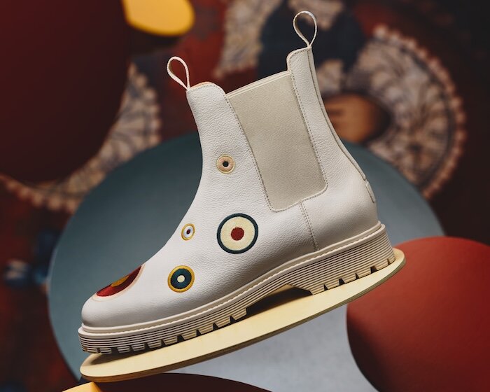 stefan sagmeister and ekn transform global data into colorful sneakers and boots