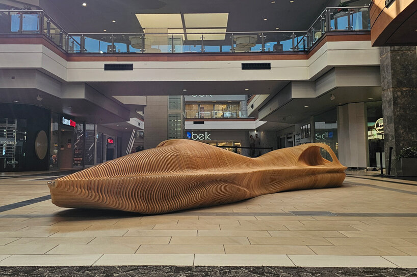 undulating plywood layers form stratum parametric public seating sculpture - 4