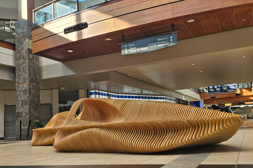 undulating plywood layers form stratum parametric public seating sculpture - 5