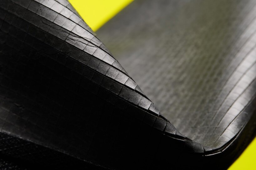vollebak turns thousands of tiny slate tiles into a flexible rock jacket - 5