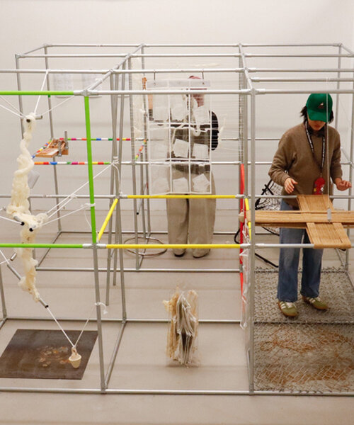metal pipe grid transforms personal rituals of control into participatory playground